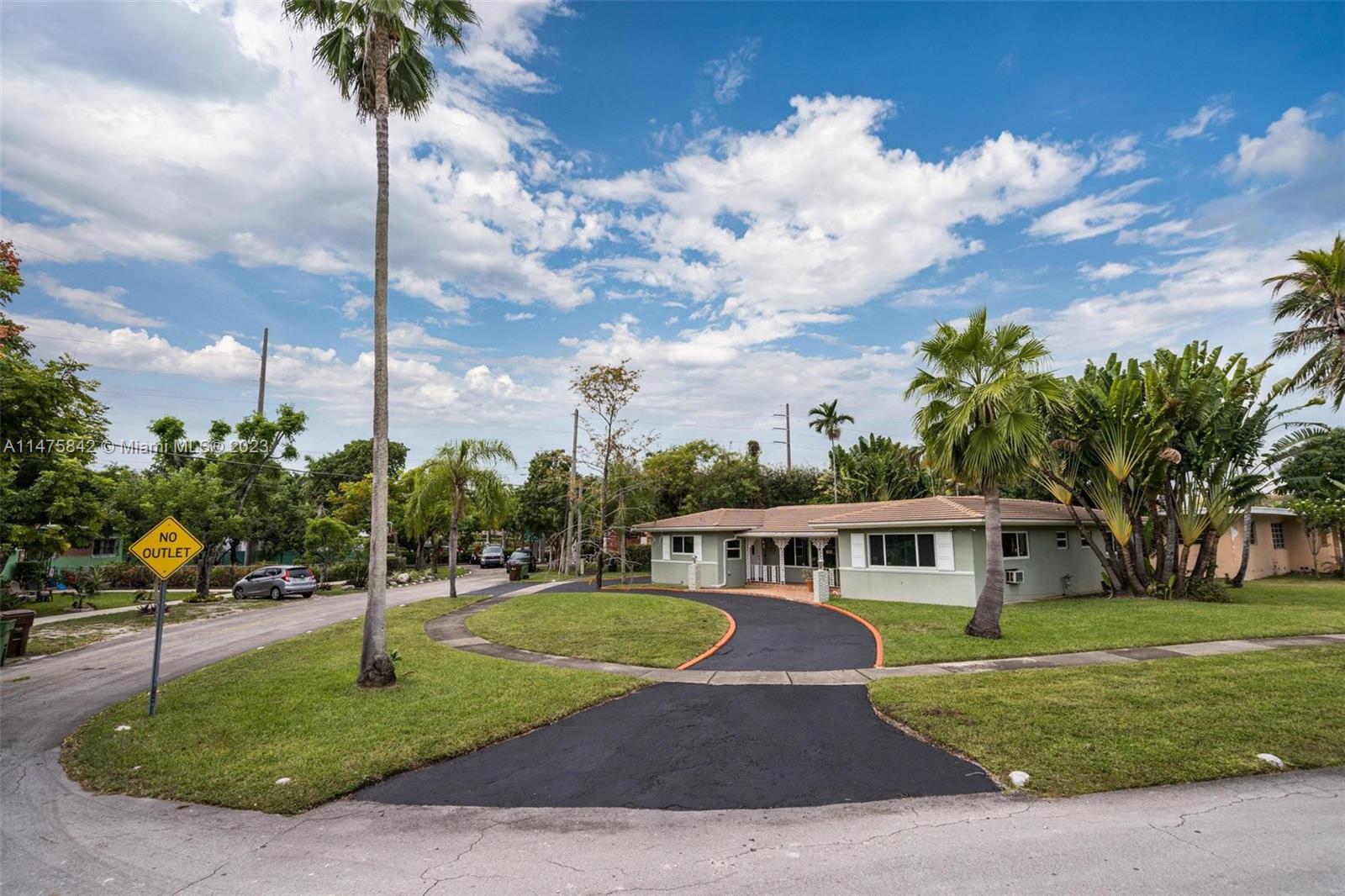 280 Eucalyptus Drive Hialeah, FL 33010 - Photo 7 of 38 a front view of a house with a yard