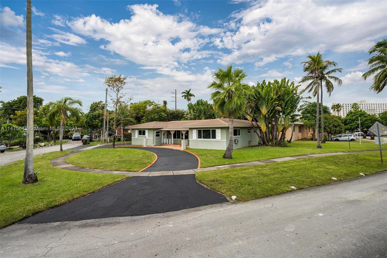 280 Eucalyptus Drive Hialeah, FL 33010 - Photo 9 of 38 a view of a house with a swimming pool and a yard
