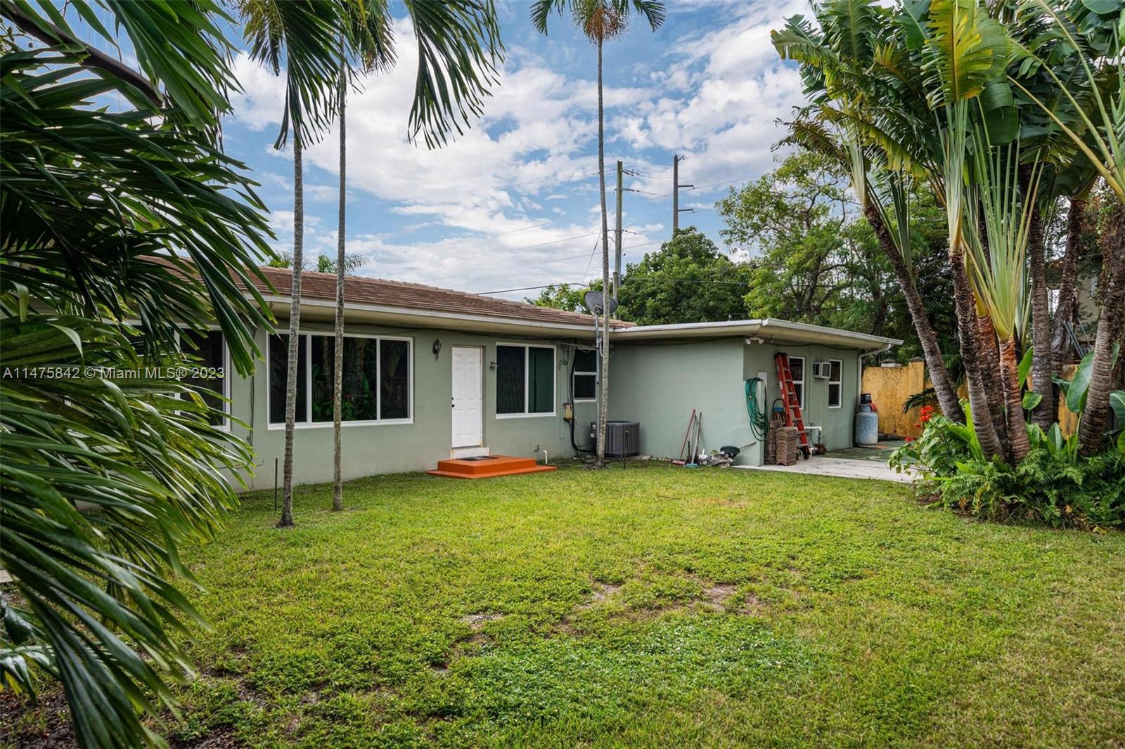 280 Eucalyptus Drive Hialeah, FL 33010 - Photo 10 of 38 a view of a house with a yard and tree