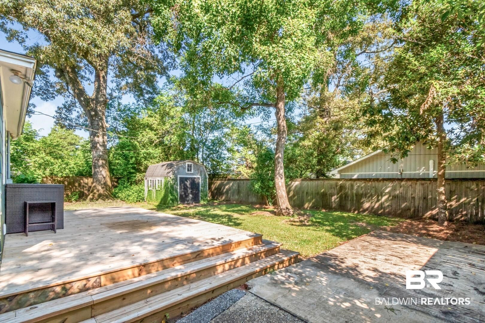 18 Princess Anne Road Mobile, AL 36608 - Photo 35 of 41 Fenced backyard featuring a shed and a deck