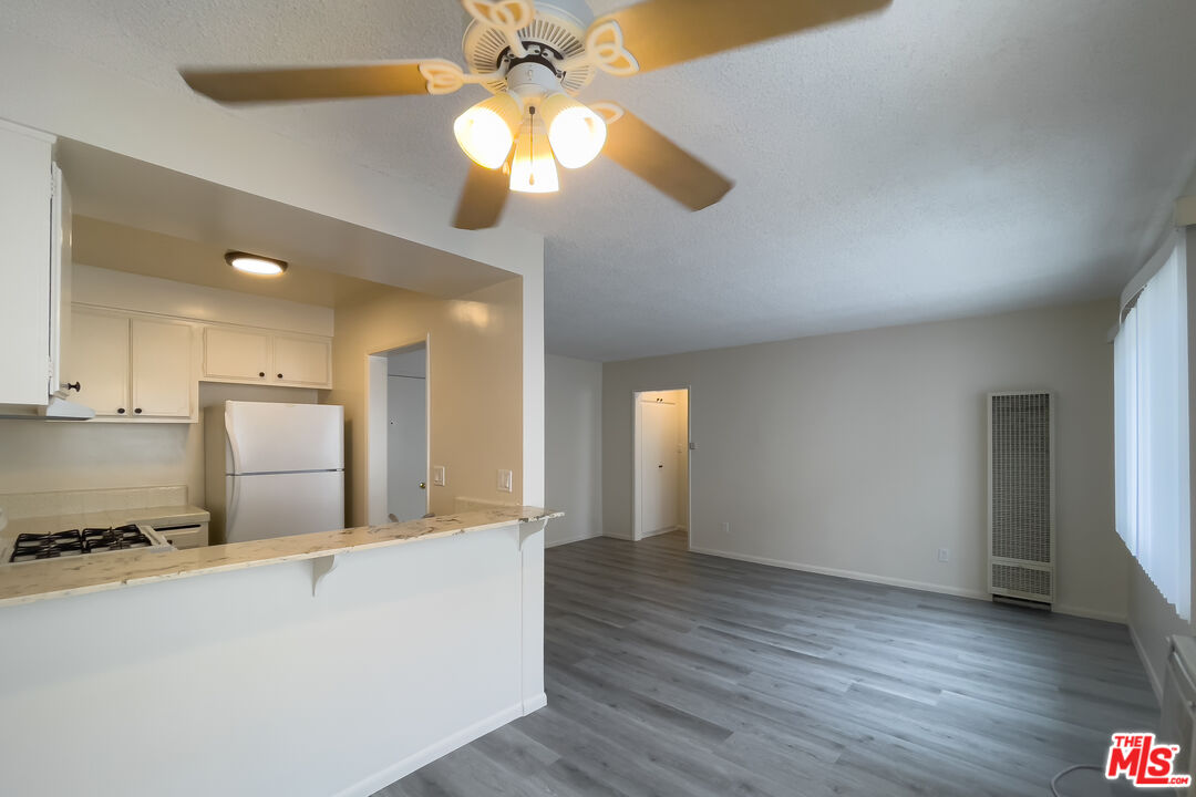3607 Clarington Avenue, Unit 2 Los Angeles, CA 90034 - Photo 1 of 11 a view of kitchen with cabinets and wooden floor