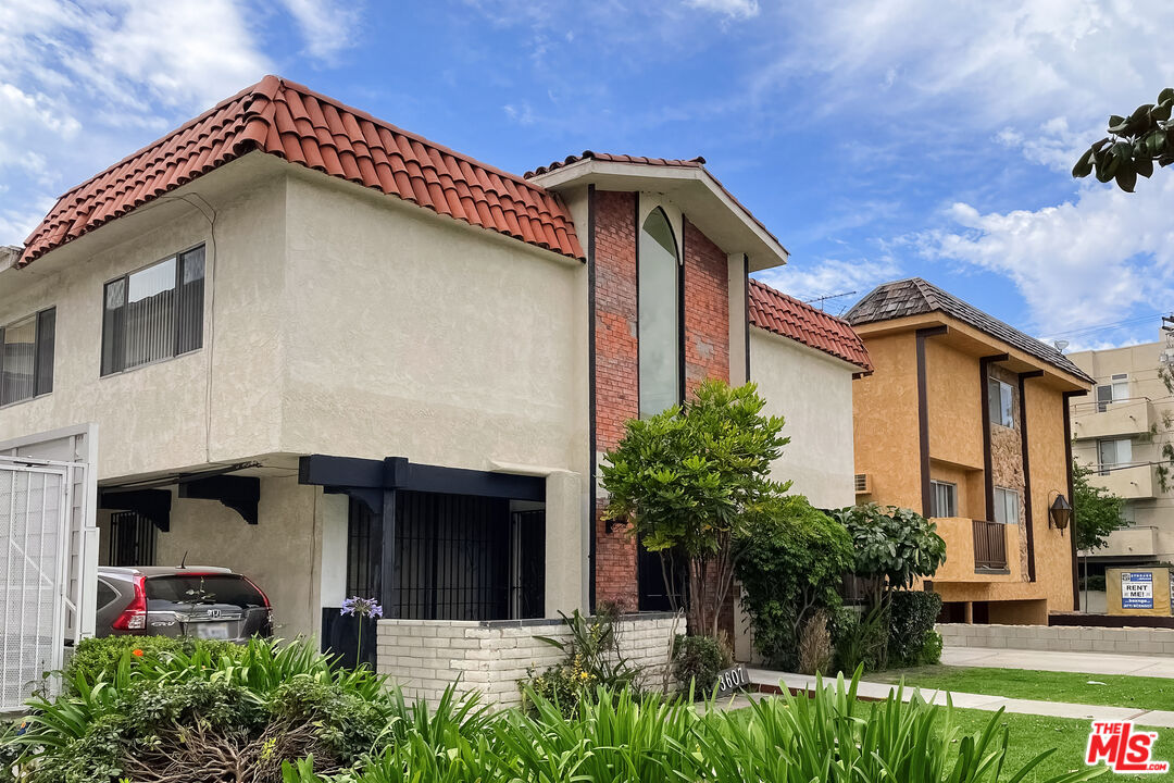 3607 Clarington Avenue, Unit 2 Los Angeles, CA 90034 - Photo 11 of 11 a view of a house with potted plants