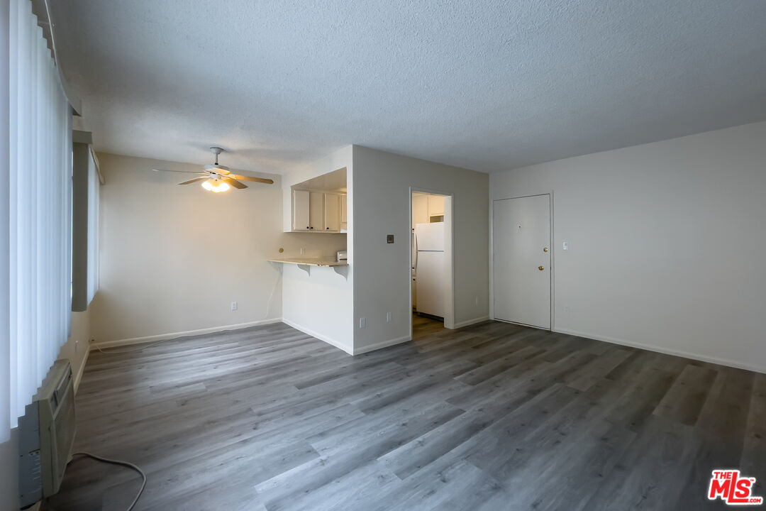 3607 Clarington Avenue, Unit 2 Los Angeles, CA 90034 - Photo 2 of 11 a view of empty room with wooden floor