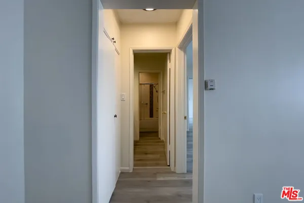 a view of a bathroom from a hallway