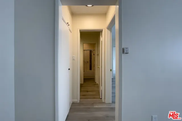 a view of a bathroom from a hallway