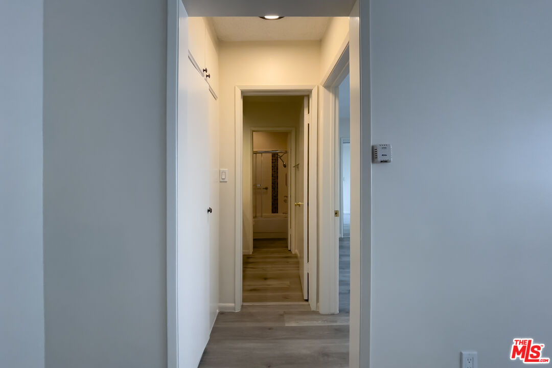 3607 Clarington Avenue, Unit 2 Los Angeles, CA 90034 - Photo 7 of 11 a view of a bathroom from a hallway
