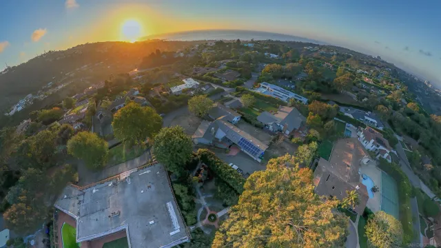 a view of a terrace with a table and chairs