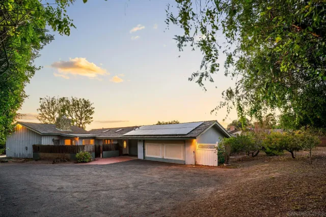 a view of a house with a tree