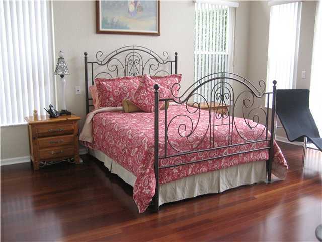 20694 Northwest 27th Terrace Boca Raton, FL 33434 - Photo 11 of 25 a bedroom with a bed next to a window with outer view