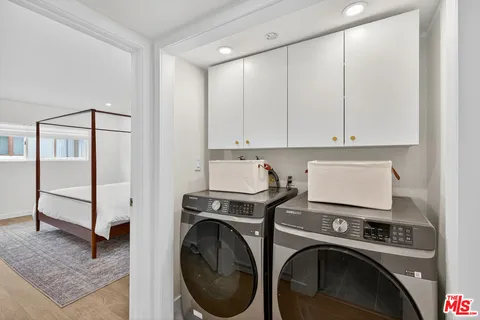a view of a storage & utility room with washer and dryer