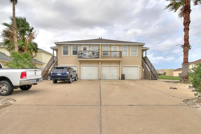 a view of a car parked in front of a house