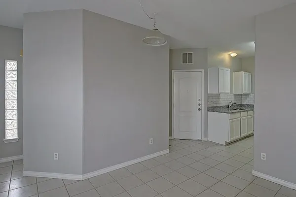 a kitchen that has a sink and a stove