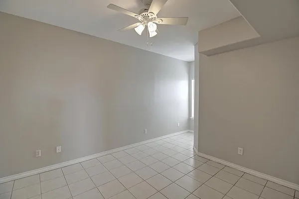 en empty room with cabinets and window