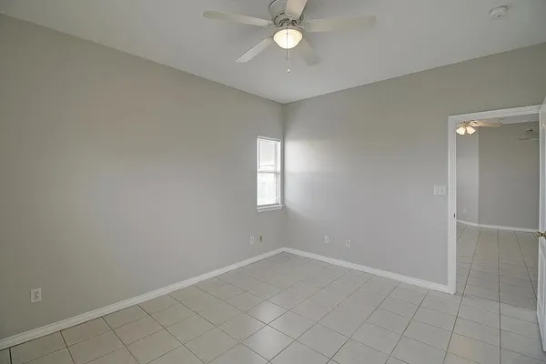 a bathroom with a granite countertop sink a toilet and bathtub