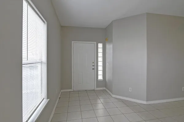 a view of an empty room and window