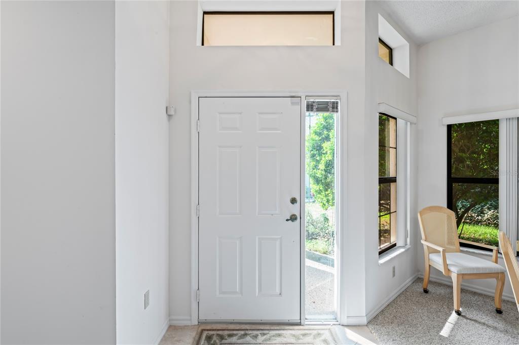 9108 Bassett Lane, Unit B New Port Richey, FL 34655 - Photo 5 of 66 a view of an entryway with wooden floor