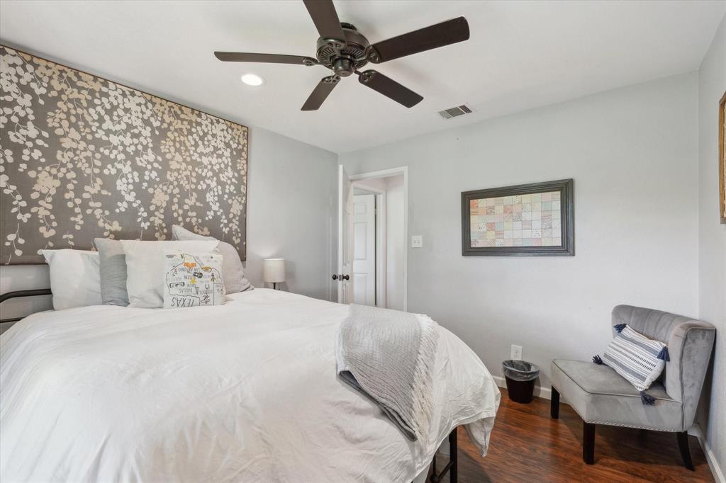 168 Barker Lane Waco, TX 76705 - Photo 11 of 31 a bedroom with a bed and a chair