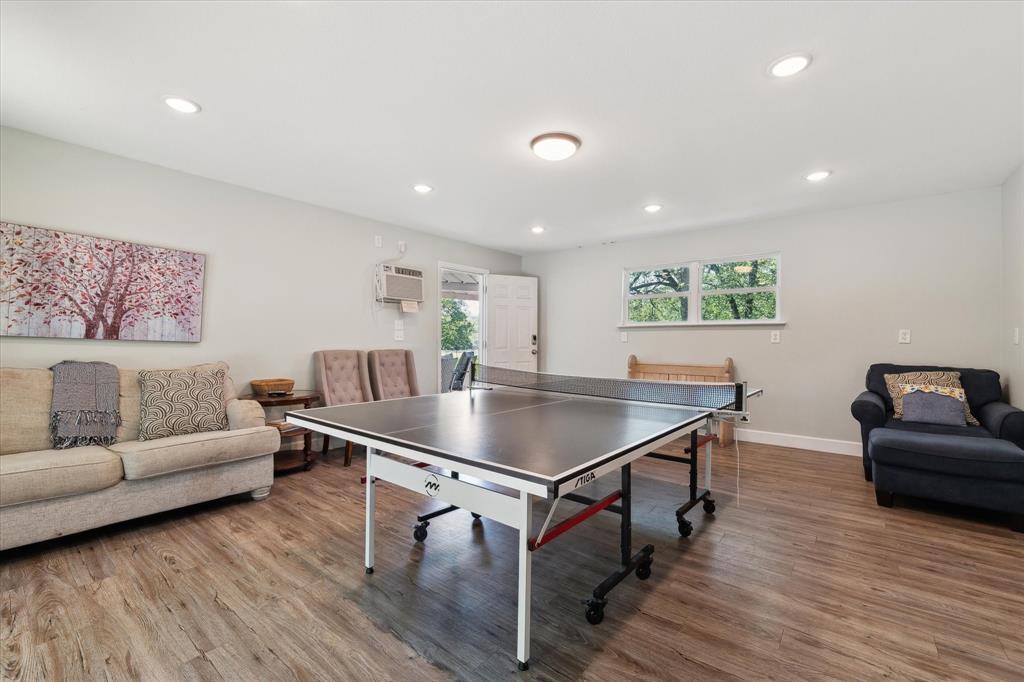 168 Barker Lane Waco, TX 76705 - Photo 17 of 31 a living room with furniture and a wooden floor