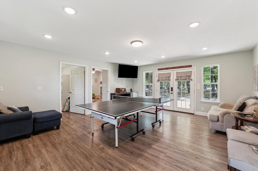 168 Barker Lane Waco, TX 76705 - Photo 18 of 31 a living room with furniture a table and a flat screen tv