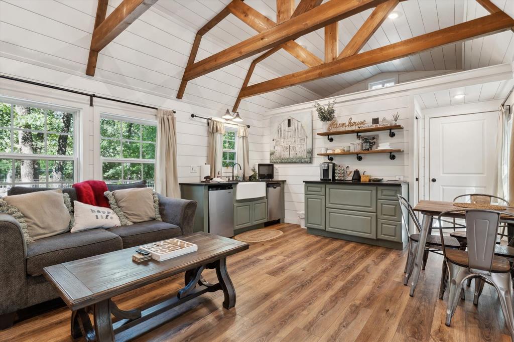 168 Barker Lane Waco, TX 76705 - Photo 23 of 31 a living room with stainless steel appliances kitchen island granite countertop furniture and a wooden floor