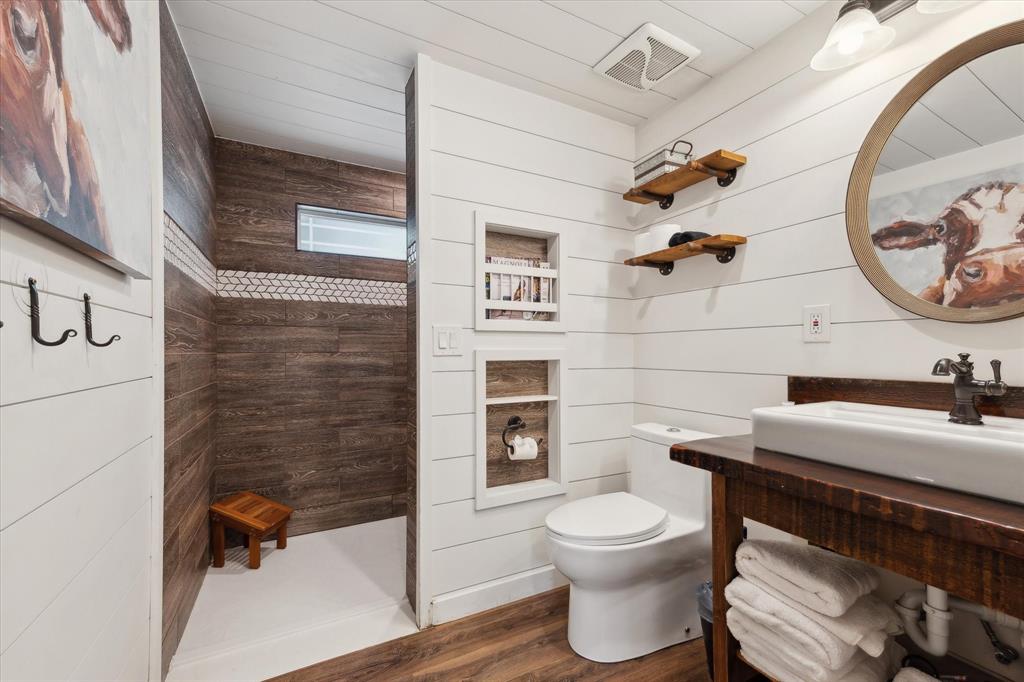 168 Barker Lane Waco, TX 76705 - Photo 26 of 31 a bathroom with a toilet a sink and a shower