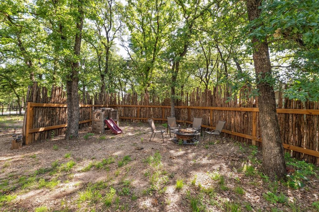168 Barker Lane Waco, TX 76705 - Photo 28 of 31 a view of a park with large trees and wooden fence