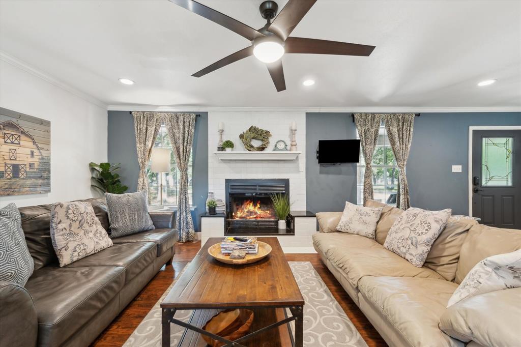 168 Barker Lane Waco, TX 76705 - Photo 4 of 31 a living room with furniture and a fireplace