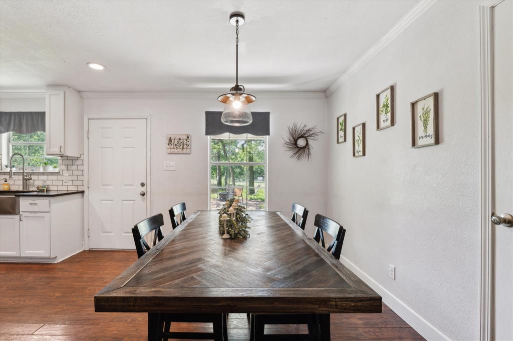 168 Barker Lane Waco, TX 76705 - Photo 5 of 31 a view of a dining room and livingroom with furniture wooden floor a chandelier