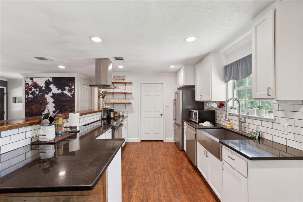 168 Barker Lane Waco, TX 76705 - Photo 6 of 31 a kitchen with stainless steel appliances granite countertop a sink stove and refrigerator