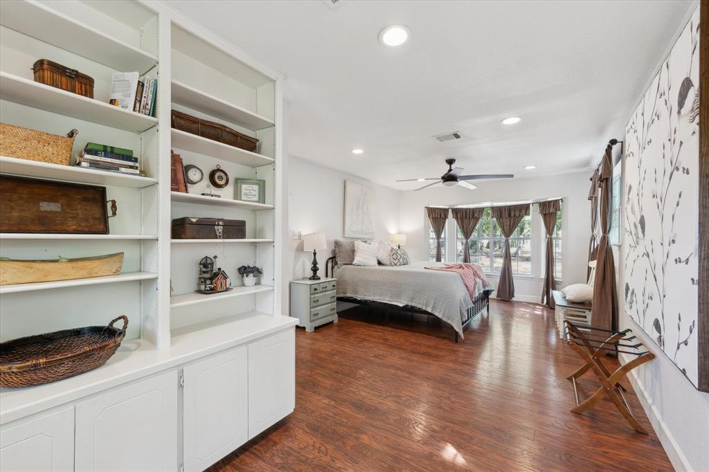168 Barker Lane Waco, TX 76705 - Photo 8 of 31 a bedroom with furniture and a book shelf