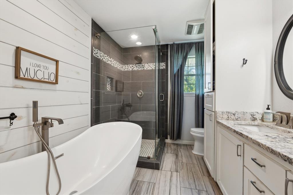 168 Barker Lane Waco, TX 76705 - Photo 10 of 31 a bathroom with a sink a toilet and shower