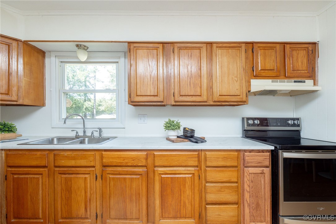 3407 Jackson Farm Road Hopewell, VA 23860 - Photo 9 of 27 Kitchen featuring ornamental molding, sink, and el
