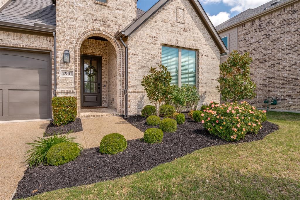 2901 Quinton Street Prosper, TX 75078 - Photo 3 of 27 a front view of a house with garden