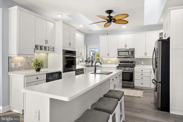 a bathroom with a double vanity sink a mirror and a shower