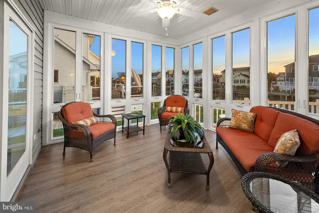 an aerial view of residential building with outdoor space lake view and boat