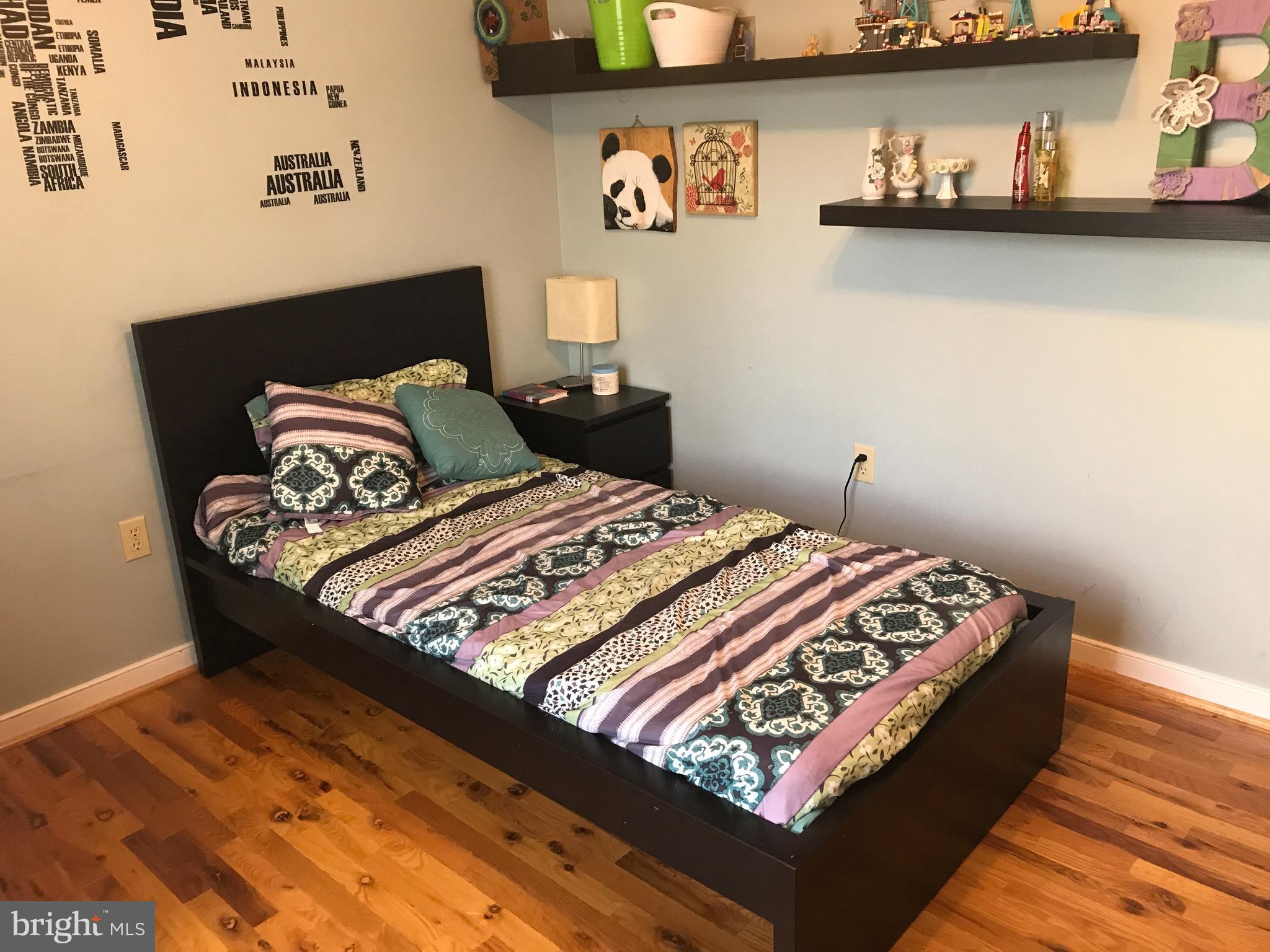 1264 Jackson Road Bumpass, VA 23024 - Photo 22 of 28 a bed sitting in a bedroom next to a wall