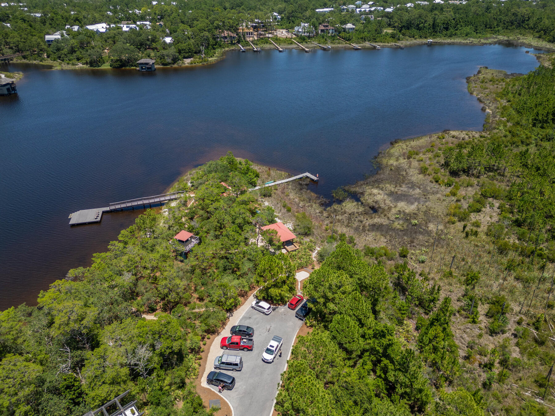 201 West Bermuda Drive Santa Rosa Beach, FL 32459 - Photo 143 of 146 an aerial view of a house with a yard and lake view