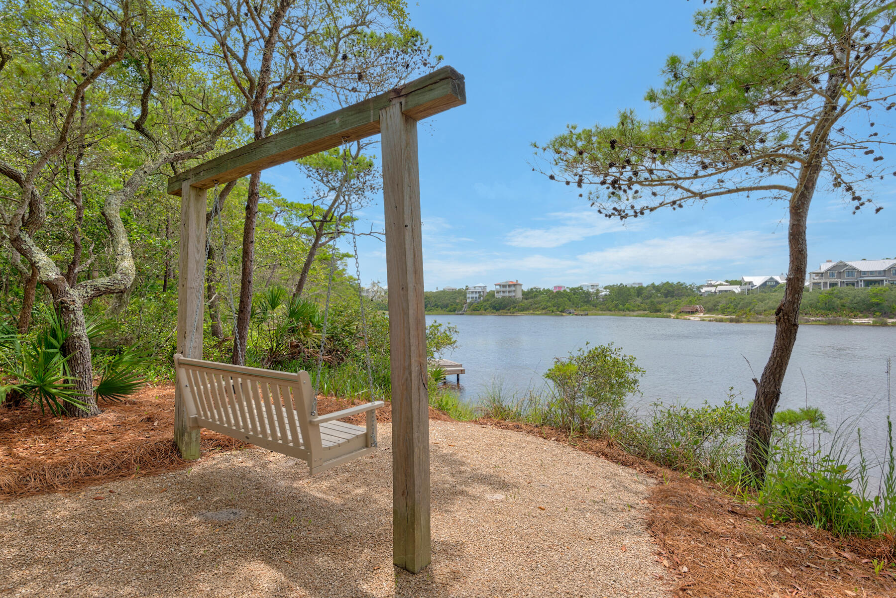 201 West Bermuda Drive Santa Rosa Beach, FL 32459 - Photo 146 of 146 a view of a lake with a floor to ceiling window next to a yard