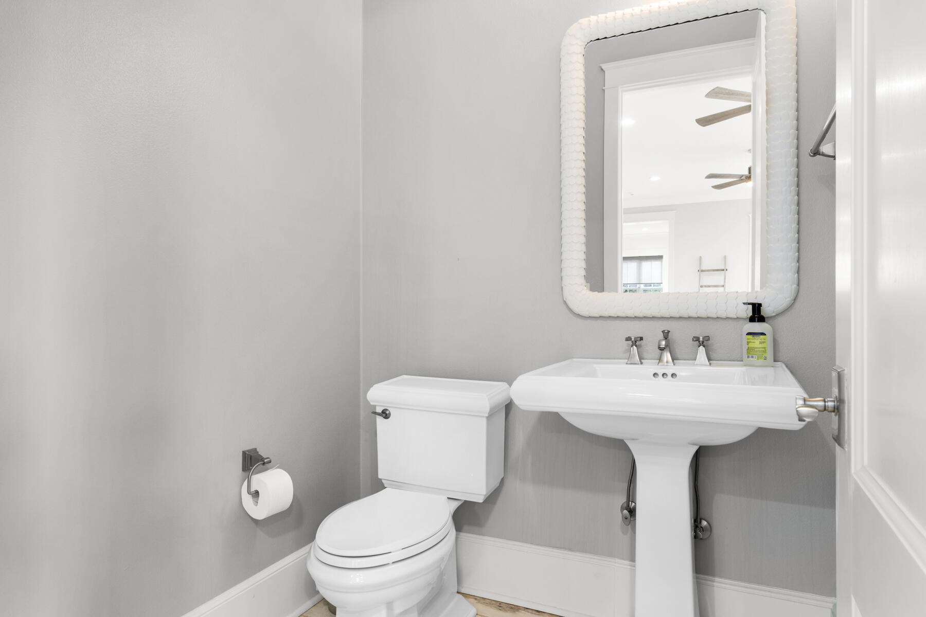 201 West Bermuda Drive Santa Rosa Beach, FL 32459 - Photo 68 of 146 a bathroom with a sink toilet and a mirror