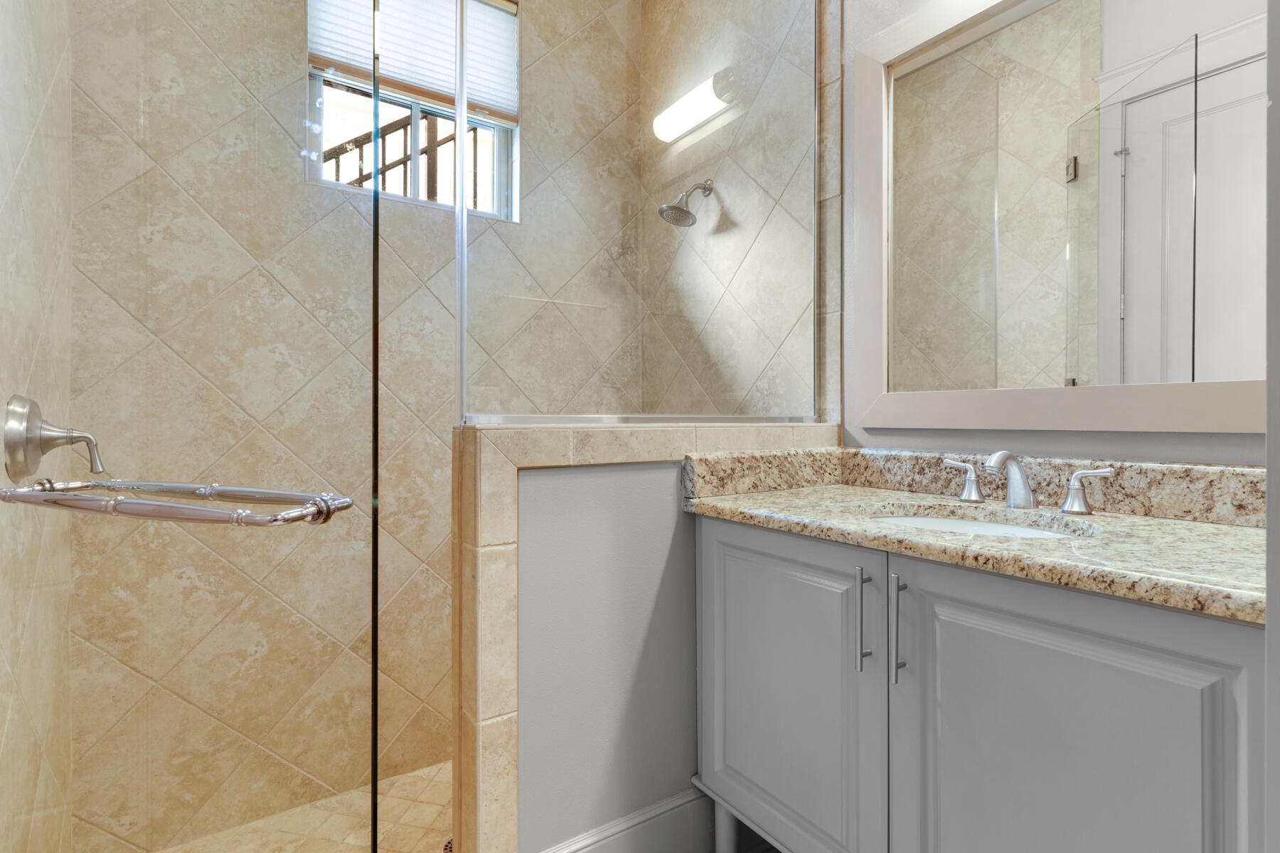 201 West Bermuda Drive Santa Rosa Beach, FL 32459 - Photo 92 of 146 a bathroom with a granite countertop sink a mirror and shower