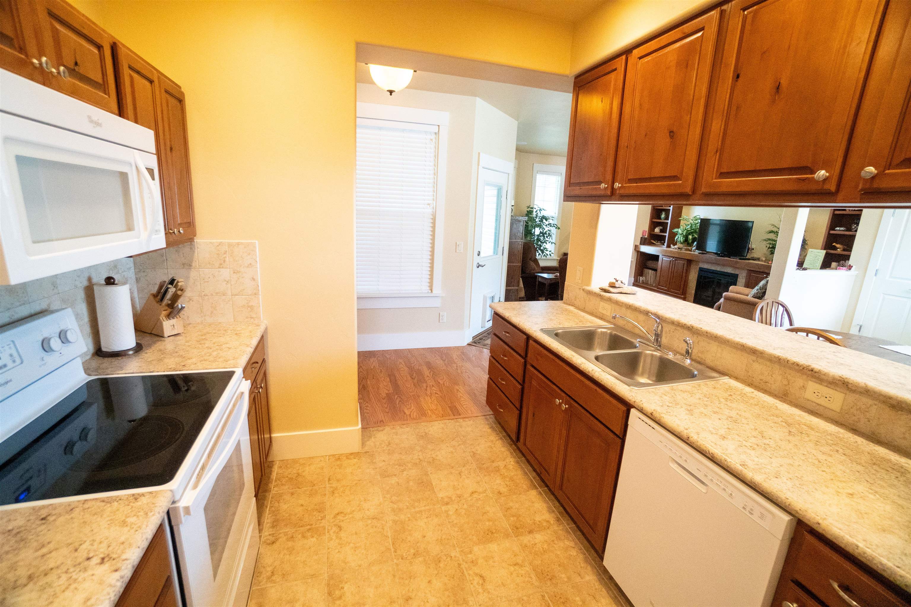 1111 Daisy Lane, Unit 32 Fruita, CO 81521 - Photo 10 of 23 a kitchen with stainless steel appliances granite countertop a sink a stove and a refrigerator