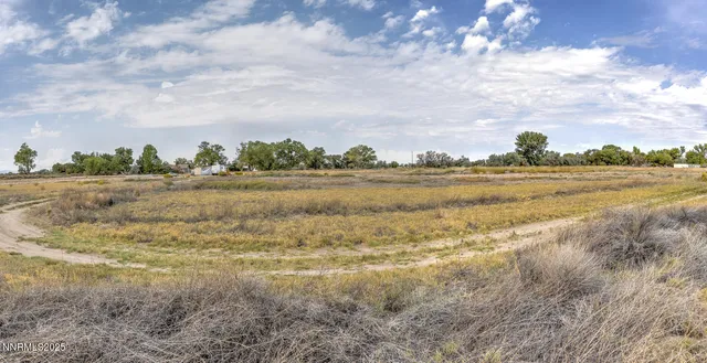 a view of a lake with houses in the back