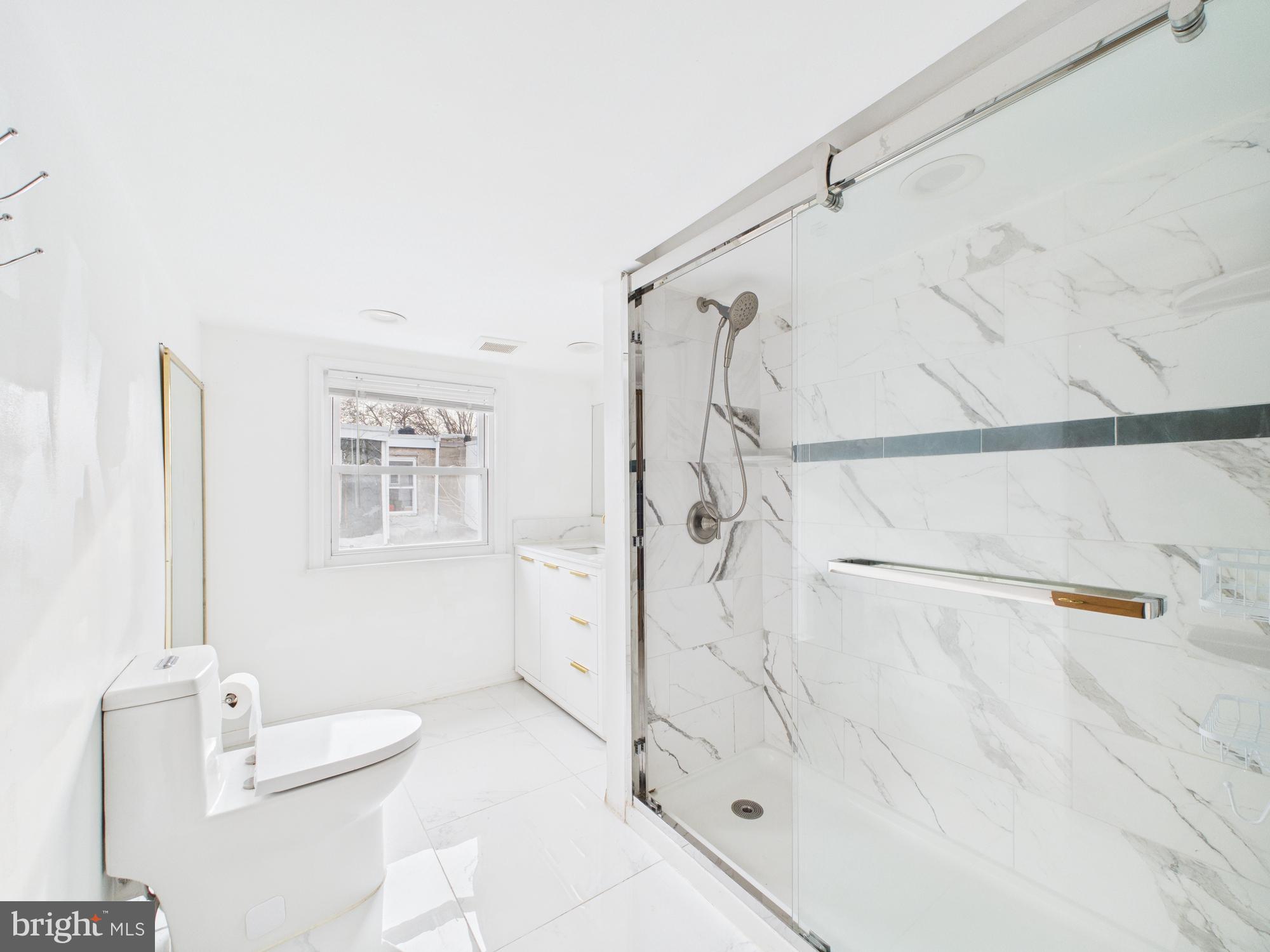 628 McClellan Street Philadelphia, PA 19148 - Photo 4 of 7 a bathroom with a shower and a sink
