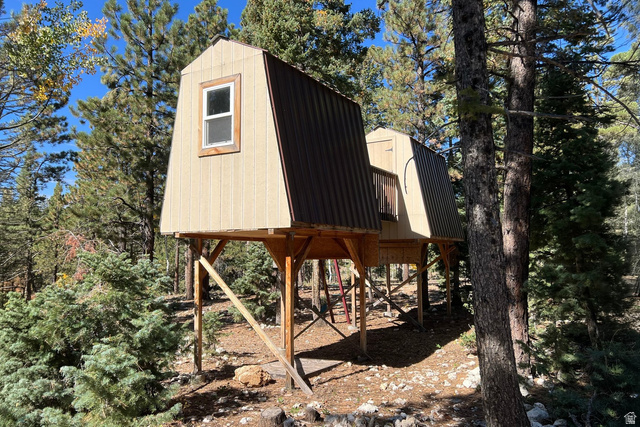 140 East Rim Road Duck Creek Village, UT 84762 - Photo 7 of 45 View of outdoor structure featuring view of wooded area