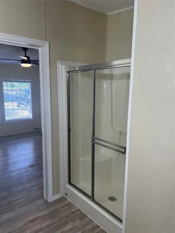 a bathroom with a bathtub and a window