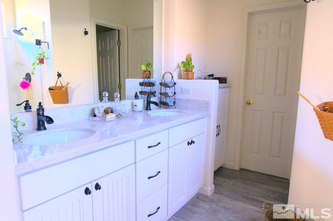 9612 Truckee Meadows Place Reno, NV 89521 - Photo 12 of 29 a bathroom with a sink and a mirror