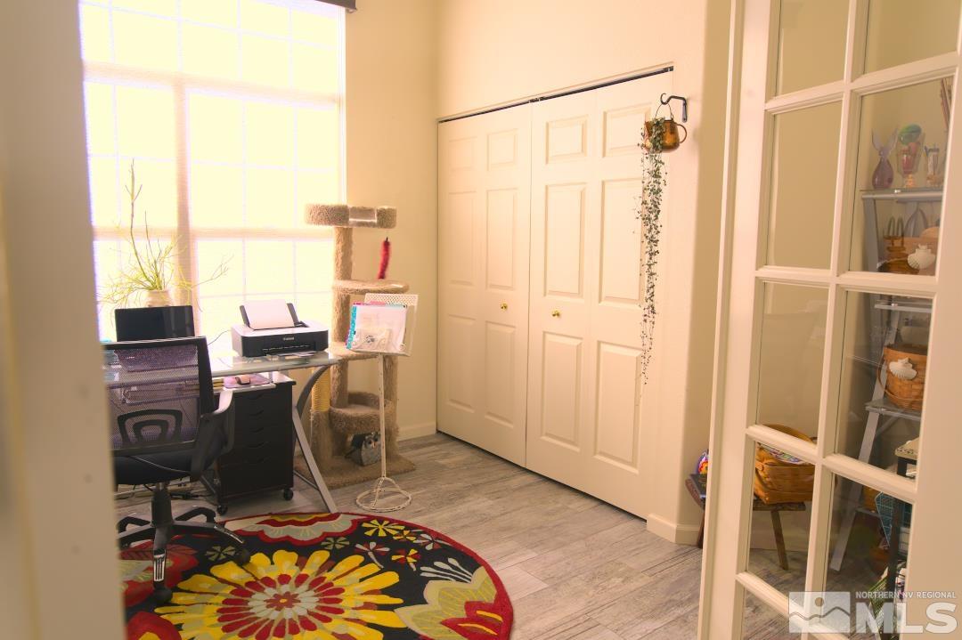 9612 Truckee Meadows Place Reno, NV 89521 - Photo 16 of 29 a view of a workspace with furniture and a window