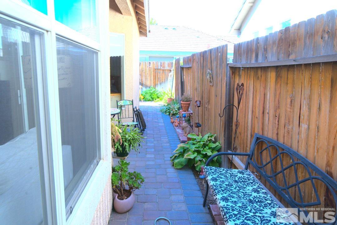 9612 Truckee Meadows Place Reno, NV 89521 - Photo 21 of 29 a view of a house with backyard and sitting area