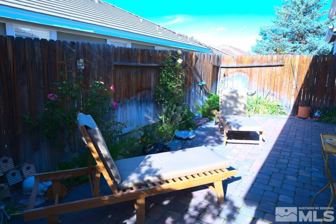 9612 Truckee Meadows Place Reno, NV 89521 - Photo 23 of 29 a view of a balcony with chairs and potted plants