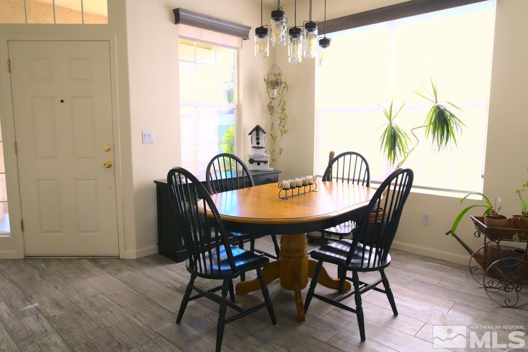 9612 Truckee Meadows Place Reno, NV 89521 - Photo 4 of 29 a view of a dining room with furniture and chandelier
